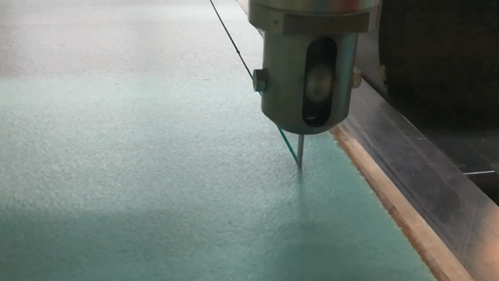Oscillating knife cutting through thick technical foam