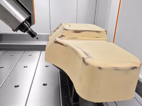 Trimming on the 5-axis machine, the part on its own fixture